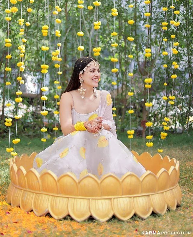 Candid Haldi ceremony photography in outdoor decor